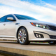 A photo of the front quarter on a white Kia Optima Sedan